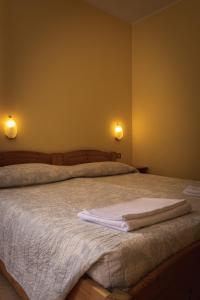 A bed or beds in a room at Agriturismo la campagnola