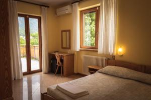 A bed or beds in a room at Agriturismo la campagnola