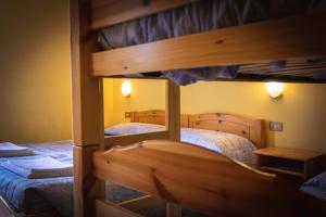 A bed or beds in a room at Agriturismo la campagnola