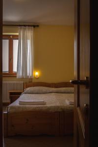 A bed or beds in a room at Agriturismo la campagnola