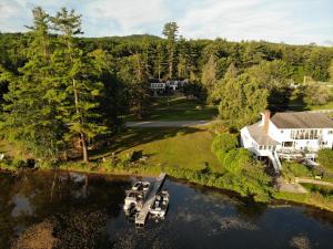 an aerial view of a house with boats in the water at Aiken Manor B&B in Franklin