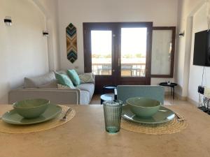 a living room with two bowls on a table at Sabina 2br penthouse in Hurghada