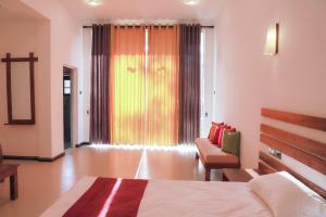 Postel nebo postele na pokoji v ubytování Hotel Anaulundawa