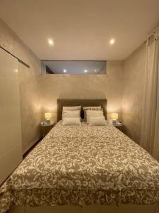 מיטה או מיטות בחדר ב-Casa Alexandra