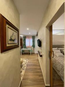 a hallway with a bedroom with a bed and a door at Casa Alexandra in Las Lagunas