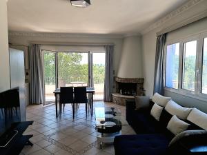 a living room with a couch and a table at Villa Juliet in Kothoníkion