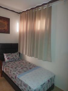 a bedroom with a bed and a window at Apartment Nador Rif in Nador