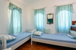 Posteľ alebo postele v izbe v ubytovaní Ancora Mokalo Apartments