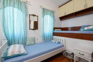 Posteľ alebo postele v izbe v ubytovaní Ancora Mokalo Apartments