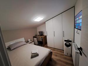 Een bed of bedden in een kamer bij Apartman ''Anno Domini''