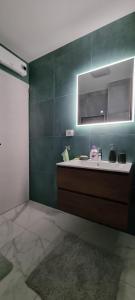 a bathroom with a sink and a mirror at Apartman ''Anno Domini'' in Rijeka +34 photos