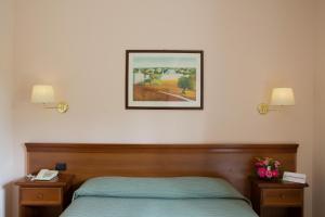 
Letto o letti in una camera di Hotel Ramapendula
