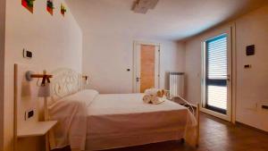 A bed or beds in a room at La Corte dei Marchesi