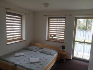 Postelja oz. postelje v sobi nastanitve Apartmány Prášily
