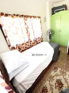 Postel nebo postele na pokoji v ubytování Villa Mercedita Subdivision - Centralized Aircon at Gene Vacation Homes