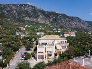 a house with a view of a mountain at Paralia Vergas Apartments in Verga Kalamata