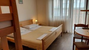 Postel nebo postele na pokoji v ubytování Pansion Klaudija