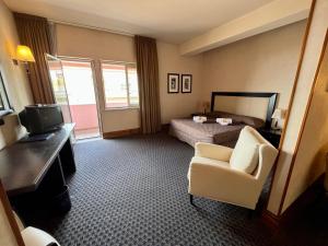 Postel nebo postele na pokoji v ubytování Hotel La Fenice