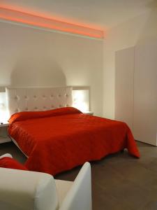 A bed or beds in a room at Fantasia B&B APARTAMENT STUDIO