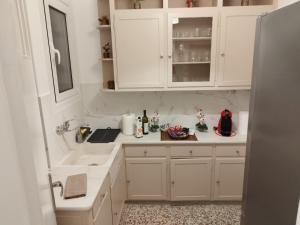 Kuchyň nebo kuchyňský kout v ubytování Zeus Apartment