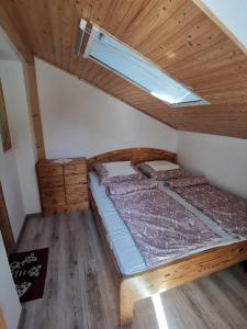 Posteľ alebo postele v izbe v ubytovaní Kaméleon Apartmanház EV töltéssel