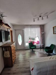 Posteľ alebo postele v izbe v ubytovaní Kaméleon Apartmanház EV töltéssel