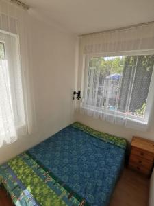 Posteľ alebo postele v izbe v ubytovaní Kaméleon Apartmanház EV töltéssel