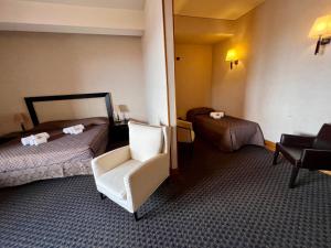 Postel nebo postele na pokoji v ubytování Hotel La Fenice