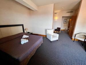 Postel nebo postele na pokoji v ubytování Hotel La Fenice
