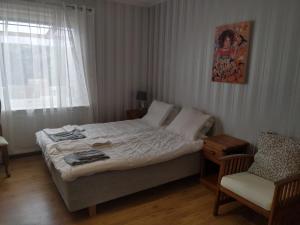 Ένα ή περισσότερα κρεβάτια σε δωμάτιο στο Hus Näckrosen