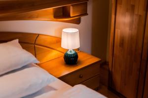 Voodi või voodid majutusasutuse Smile Apartments mit Donaublick toas