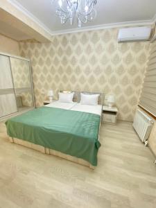 Ein Bett oder Betten in einem Zimmer der Unterkunft Samarkand Fruza гостевой дом
