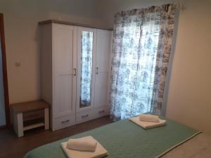 Postel nebo postele na pokoji v ubytování Lucija