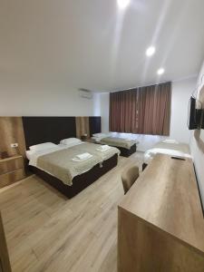 Posteľ alebo postele v izbe v ubytovaní Hotel Vesna