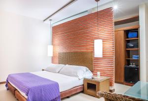 Ένα ή περισσότερα κρεβάτια σε δωμάτιο στο Hotel Santorini Resort