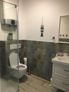 Kúpeľňa v ubytovaní Łebska Ostoja TDW + 8 fotografií