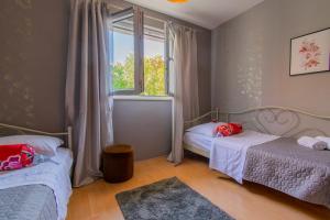 Postel nebo postele na pokoji v ubytování Villa Lean