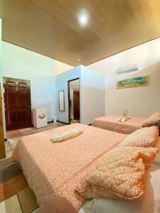 Ein Bett oder Betten in einem Zimmer der Unterkunft Hotel Sunset Rooms