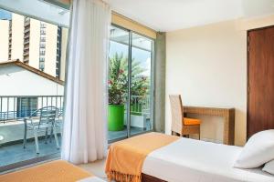 Ένα ή περισσότερα κρεβάτια σε δωμάτιο στο Hotel Santorini Resort