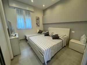 Posteľ alebo postele v izbe v ubytovaní Appartamento Albachiara Vistamare