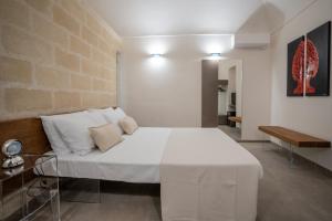 Łóżko lub łóżka w pokoju w obiekcie Setteminne Resort Design