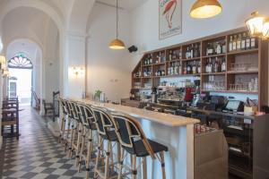 a bar with chairs lined up at a restaurant at Il Capri Hotel in Capri