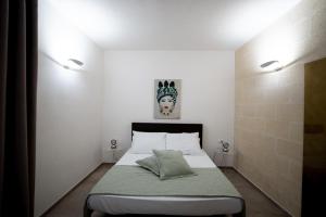 Łóżko lub łóżka w pokoju w obiekcie Setteminne Resort Design