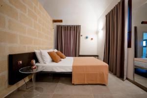 Łóżko lub łóżka w pokoju w obiekcie Setteminne Resort Design