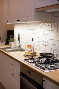 A kitchen or kitchenette at Friends Hostel & Apartments