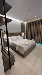 Postel nebo postele na pokoji v ubytování NERIUM Hotel