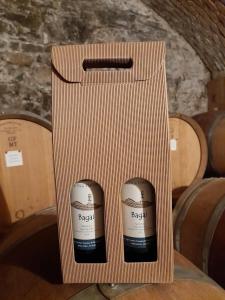 a cardboard box with two cups on a table at Cascina Teresina in Veleso +15 photos