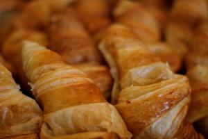 a pile of croissants sitting on top of each other at Le Rose Thé in La Ciotat