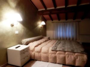 Postel nebo postele na pokoji v ubytování Country House La Fattoria Bellandi