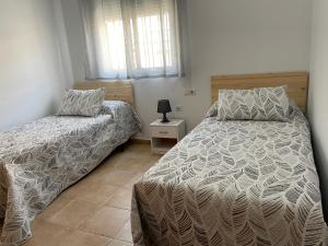 En eller flere senge i et værelse på PISO CARAMBUCO